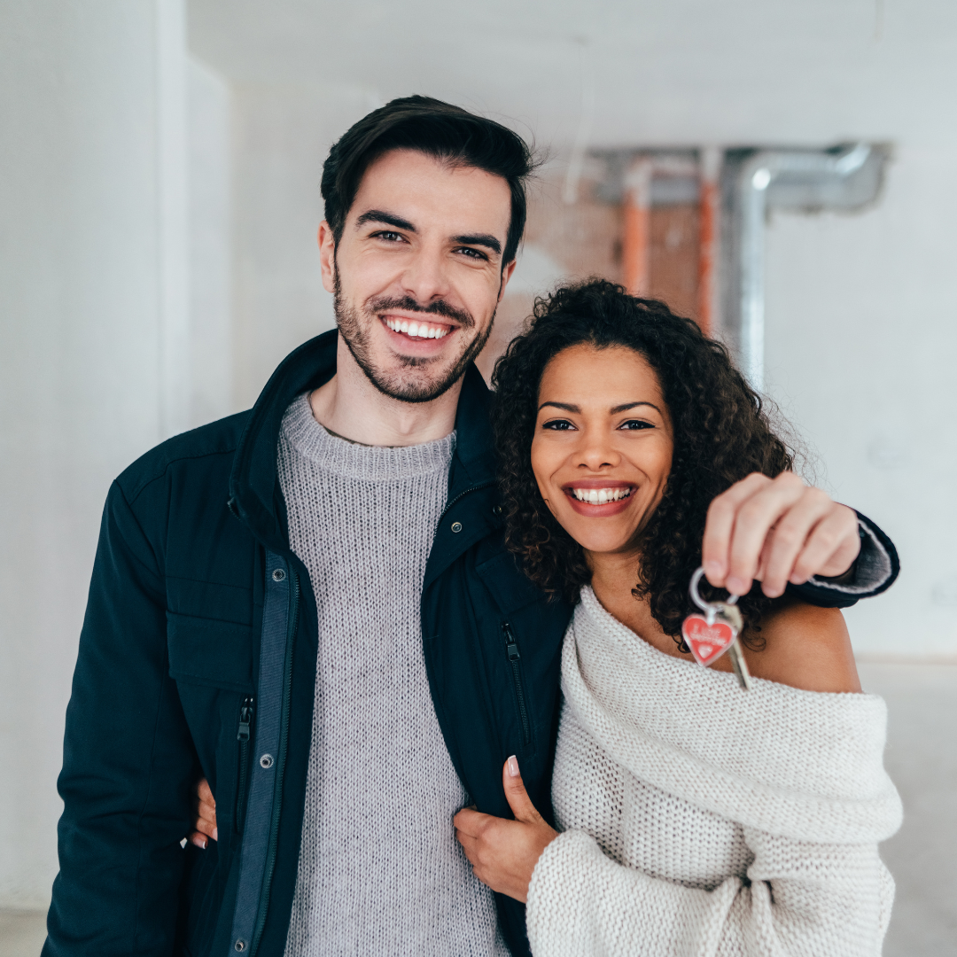 A couple happy about their home purchase